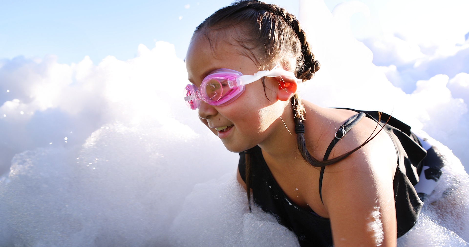 Girl swimming in foam - Foam Fiesta in Hialeah