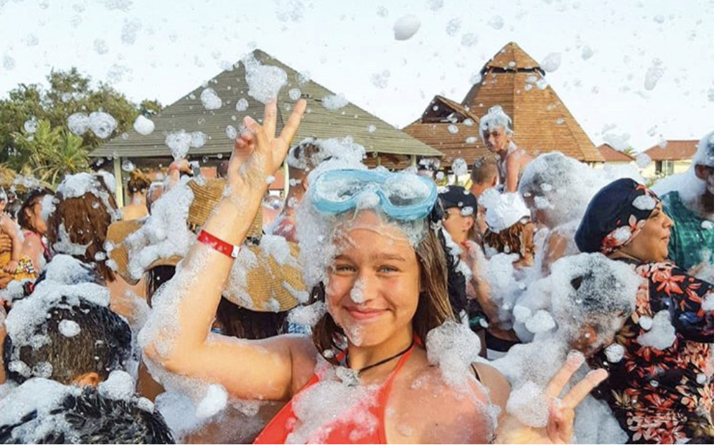 Teen with goggles in foam - Foam Fiesta foam party rentals Hialeah, FL