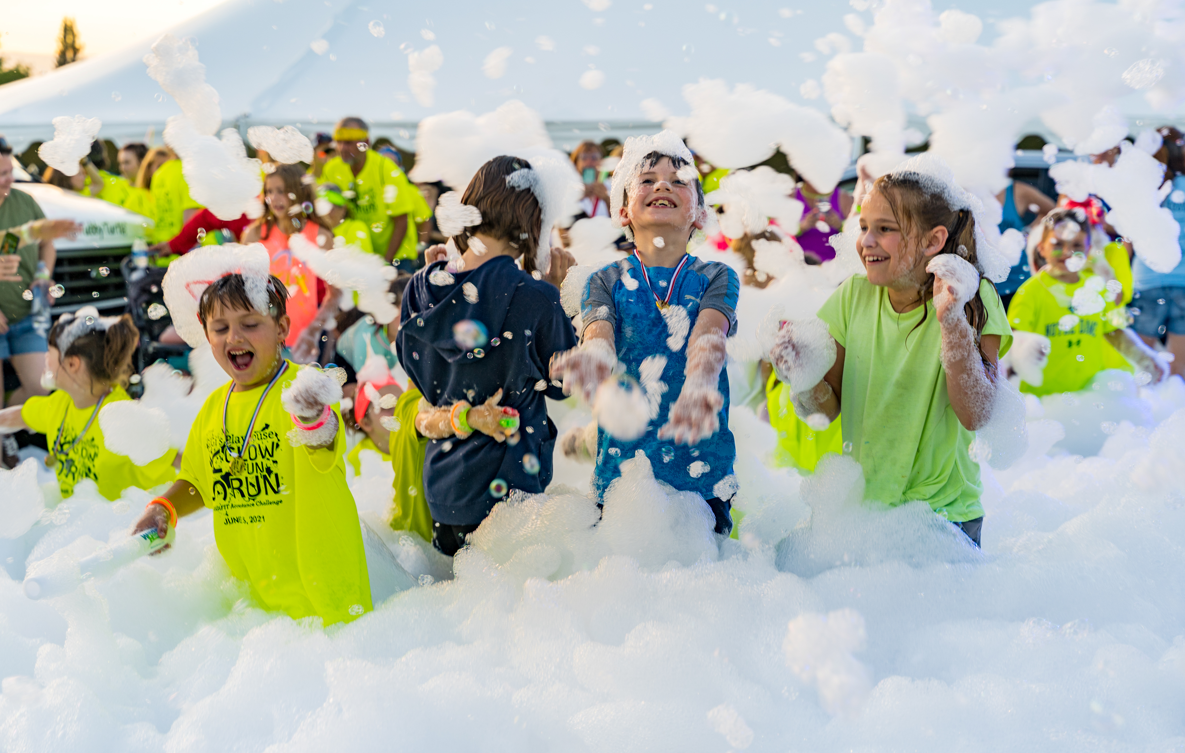 Kids running through foam at a party - Foam Fiesta foam party rentals Hialeah, FL
